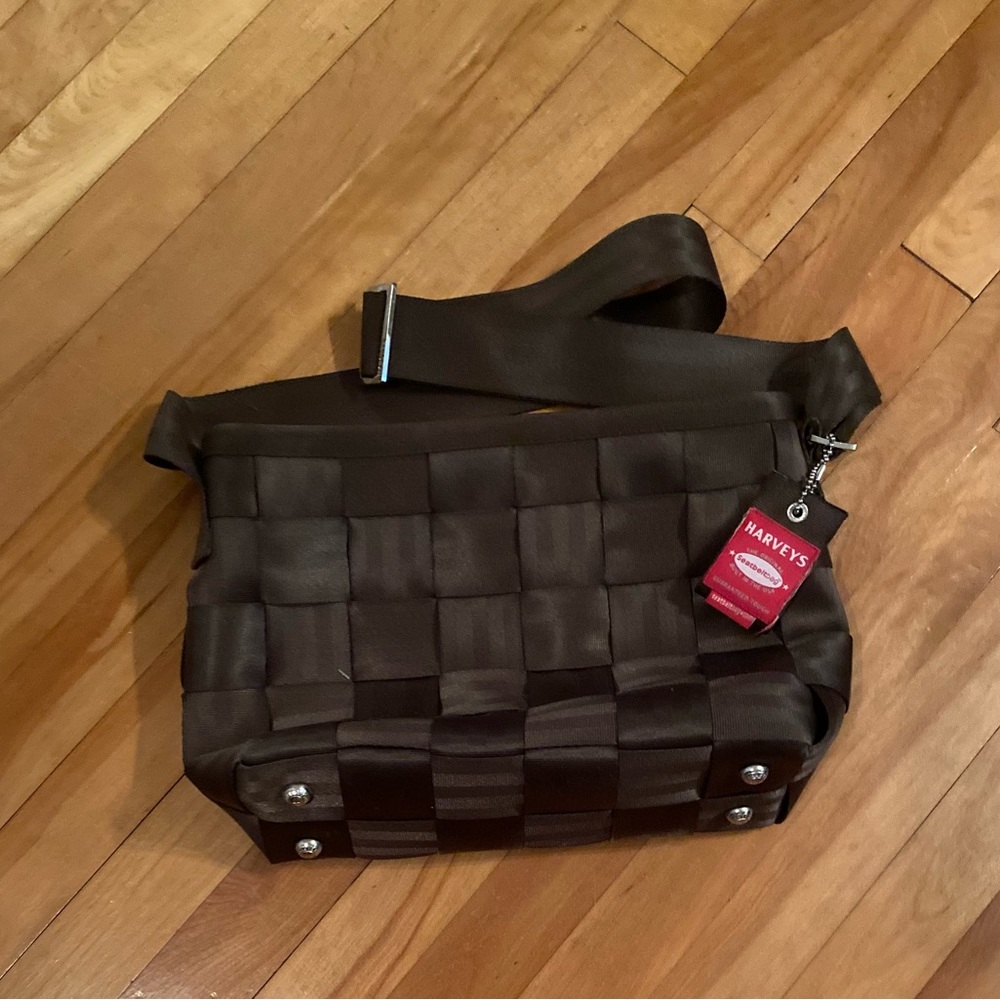 Harvey’s brown messenger bag